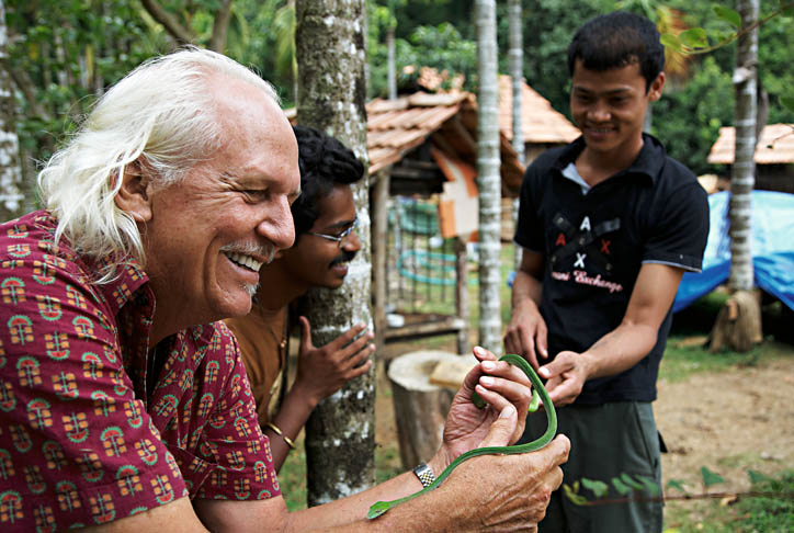 romulus-whitaker-photo-by-rolex A young volunteer gets to know a snake at Agumbe research station - photo courtesy Rolex Awards