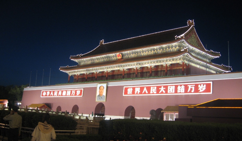 Day or night, he keeps vigil over Tiananmen Square...