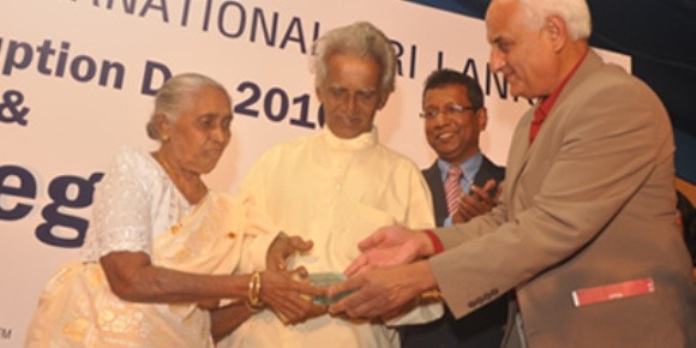 Poddala Jayantha's mother and father receiving award from Kanak Mani dixit (extreme R)