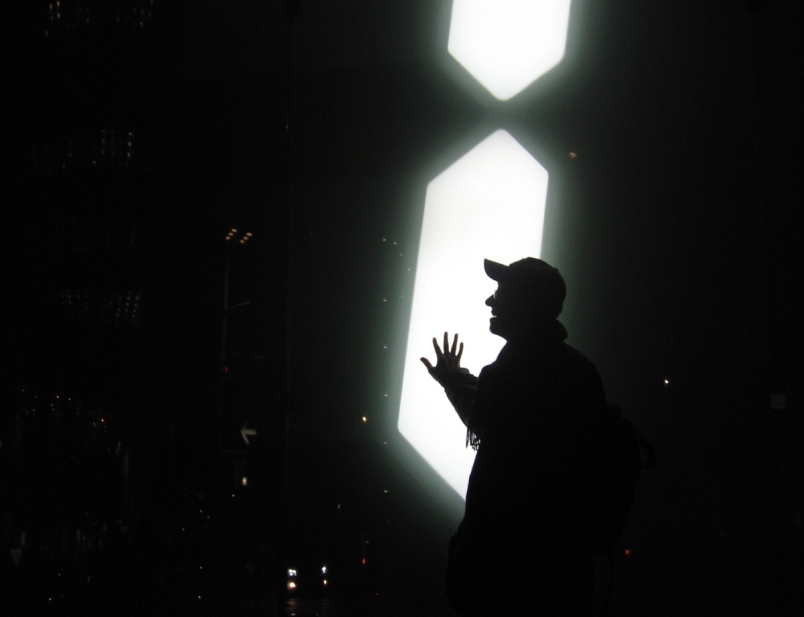 Nalaka G in front of giant digital clock in Tokyo 2.jpg