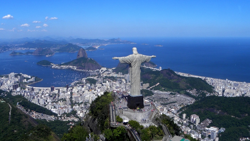 Statue of Christ the Redeemer looks down on Rio de Janeiro from Corcovado Mounain