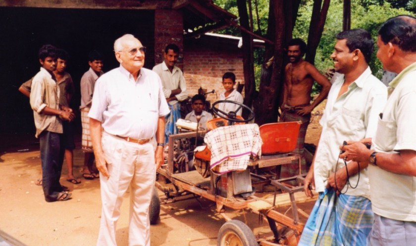 Ray Wijewardene talking about agricultural machinery to staff at a farm in Anuradhapura district, Sri Lanka.