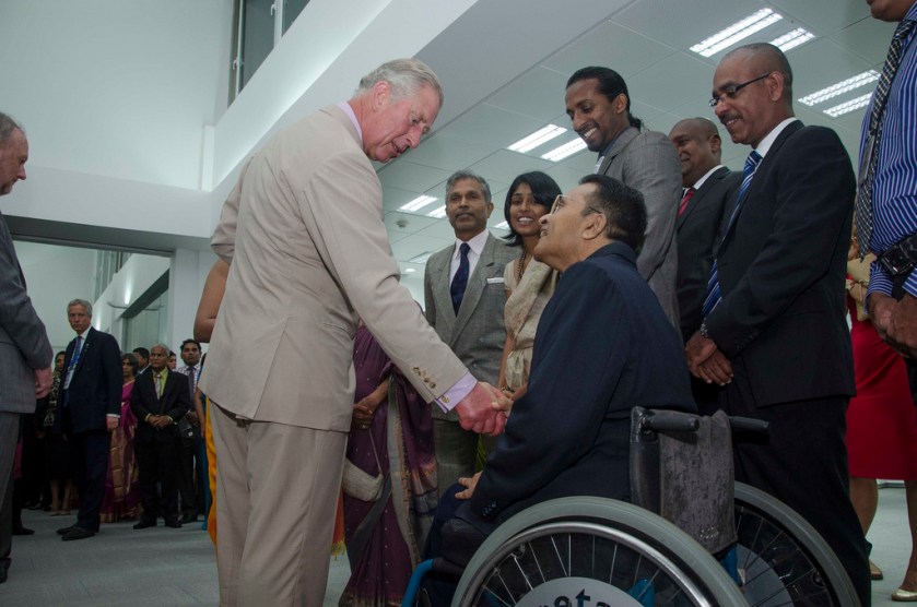 Prince Charles talks with Dr Ajith C S Perera, activist for mobility access, at the opening of British Council new building in Colombo, 16 Nov 2013 - Photo courtesy British Council Sri Lanka