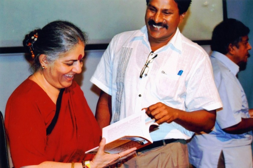 Sydney Marcus Dias presenting a copy of his Sinhala translation of Stolen Harvest to Dr Vandana Shiva in Colombo, June 2014