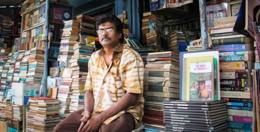 Priyankara Pitiduwagamage, owner of Priyankara Bookshop on the D.R. Wijewardena Mawatha, an avenue in Colombo, waits for customers outside his secondhand bookshop. He and other bookshop owners hope that they will be integrated into the new entertainment and leisure facilities being developed on this street by the government. GPI Photo by Chathuri Dissanayake