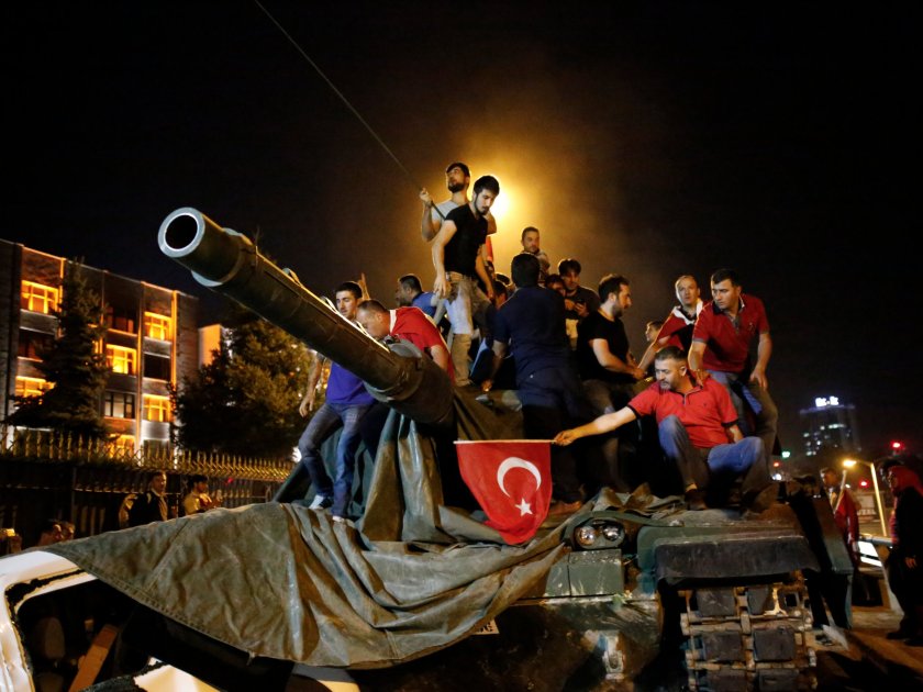 People stand on a Turkish army tank in Ankara on July 16 - Reuters